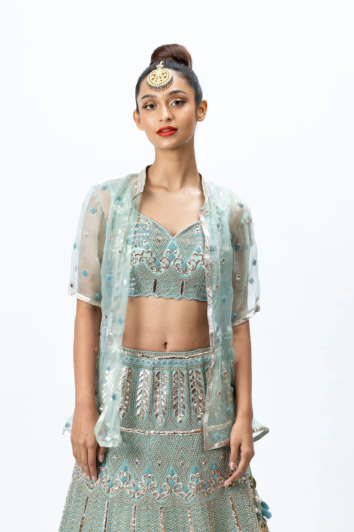 Mint Green Hand-embroidered Lehenga paired with Hand-embroidered Blouse, Hand-embroidered Dupatta and Hand-embroidered Jacket with Buttis