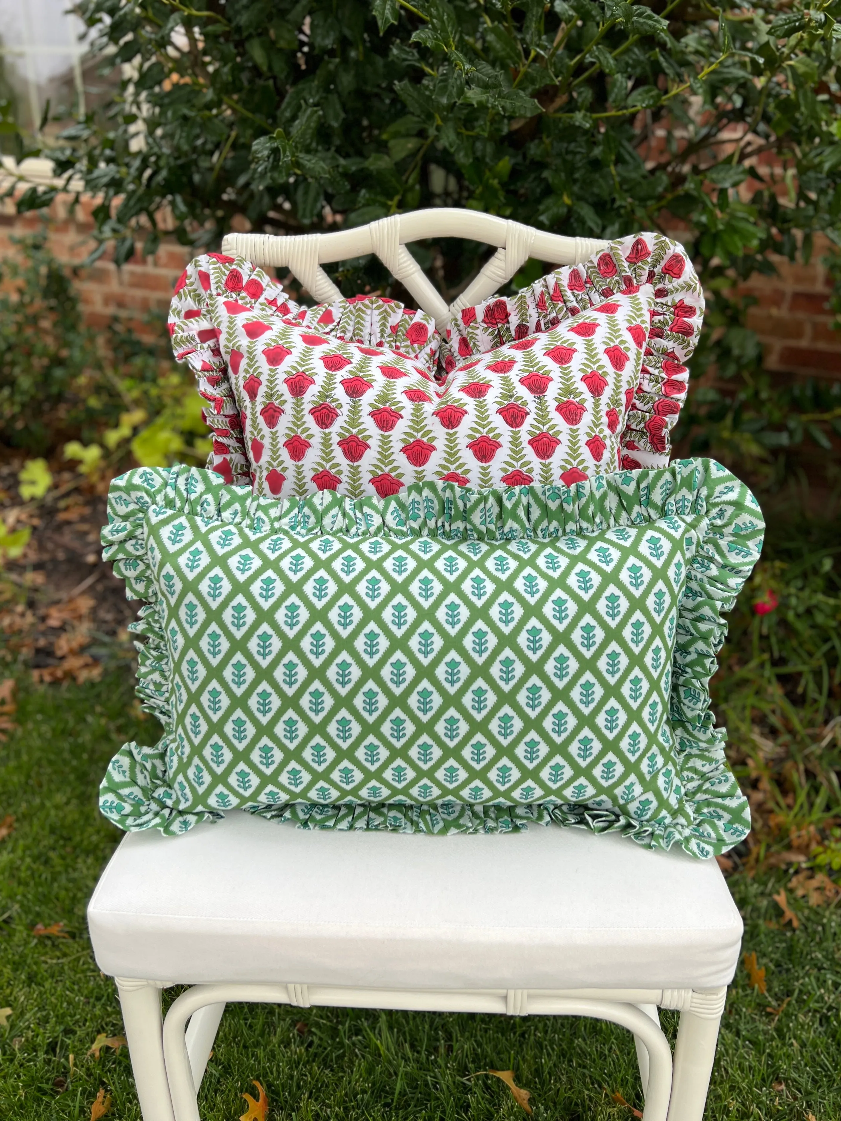 Red and green block print pillow cover with ruffle trim