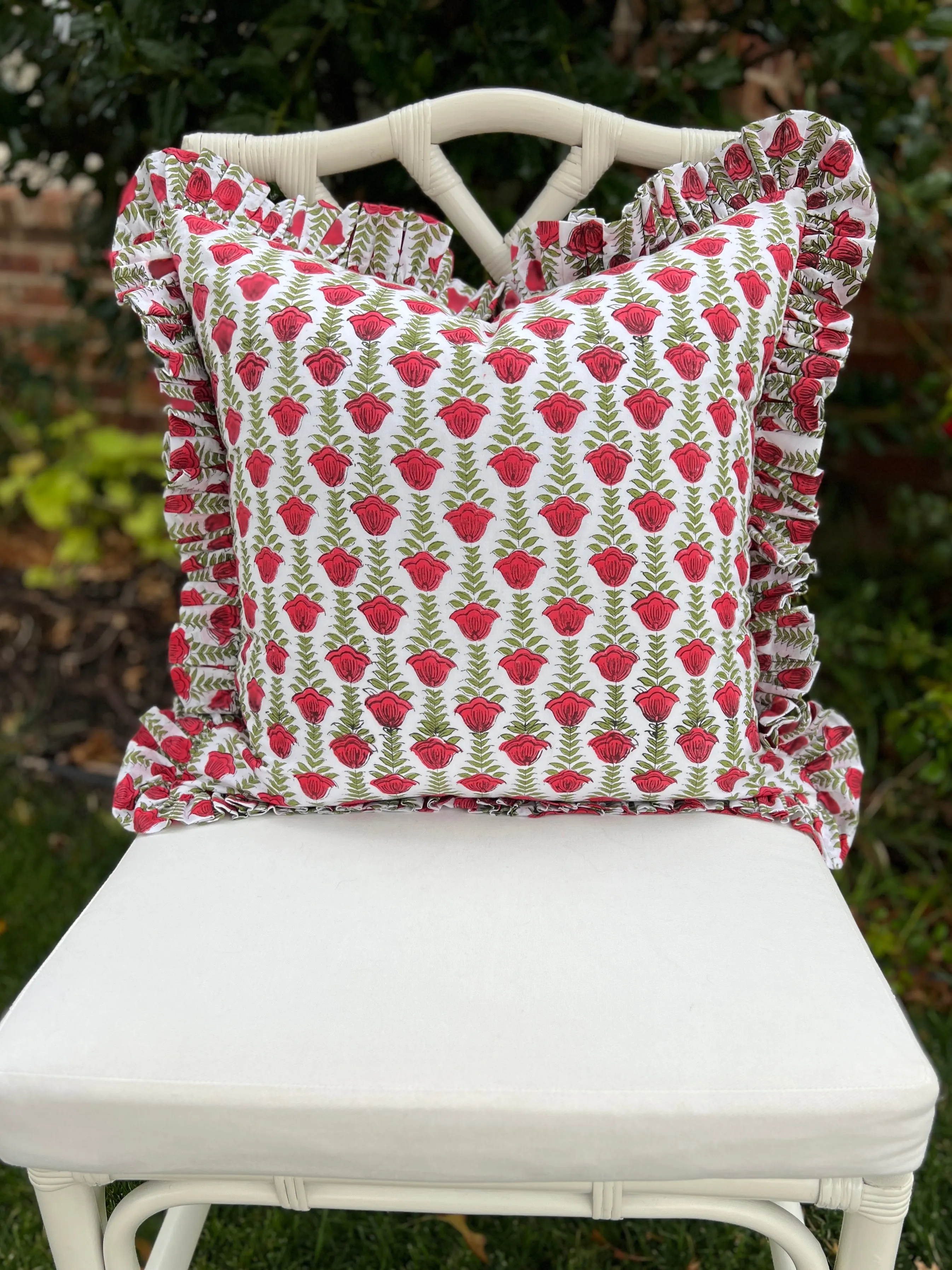 Red and green block print pillow cover with ruffle trim